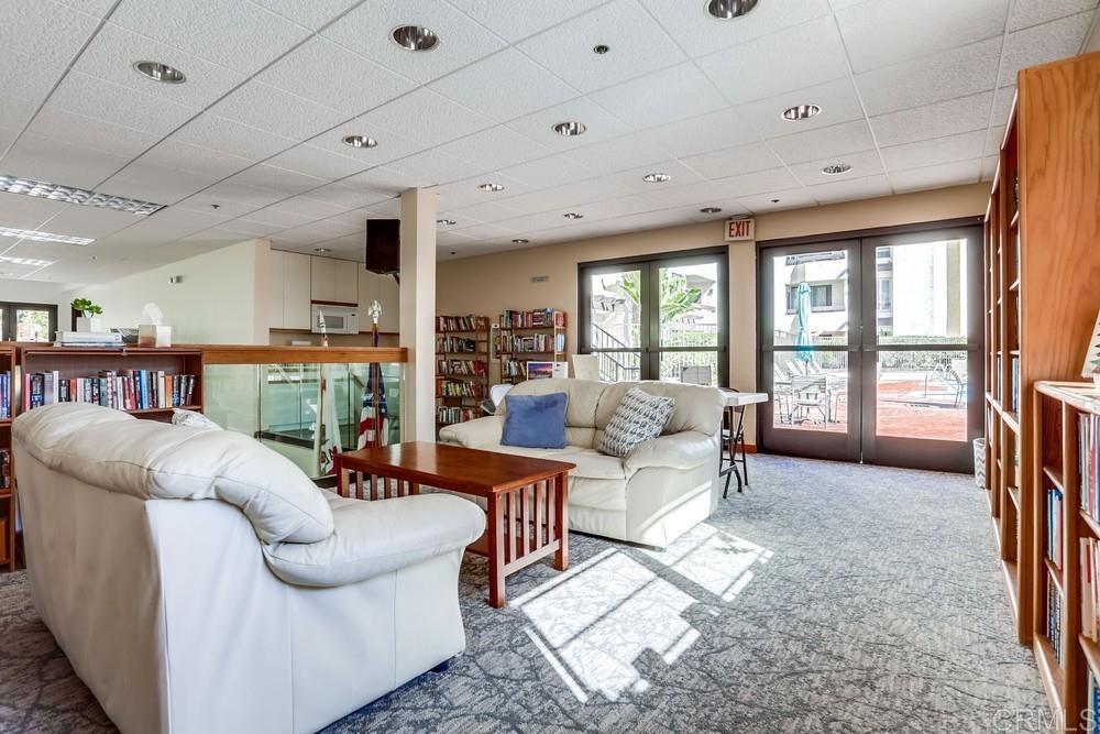 5875 Friars Road, Unit 4404 San Diego, CA 92110 - Photo 22 of 32 a living room with furniture and a large window