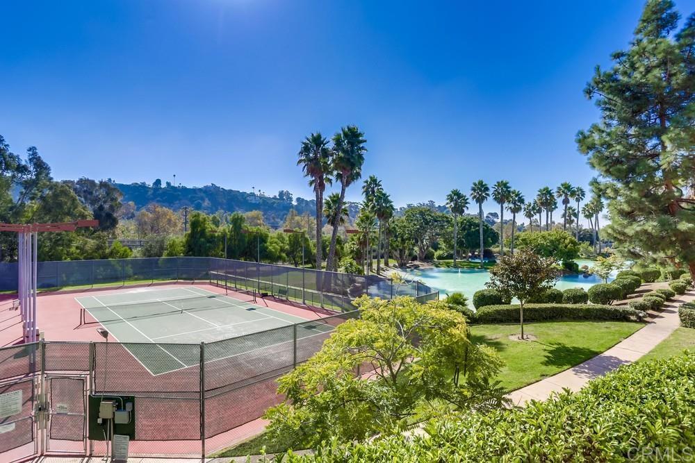 5875 Friars Road, Unit 4404 San Diego, CA 92110 - Photo 25 of 32 a view of a swimming pool with a yard and plants