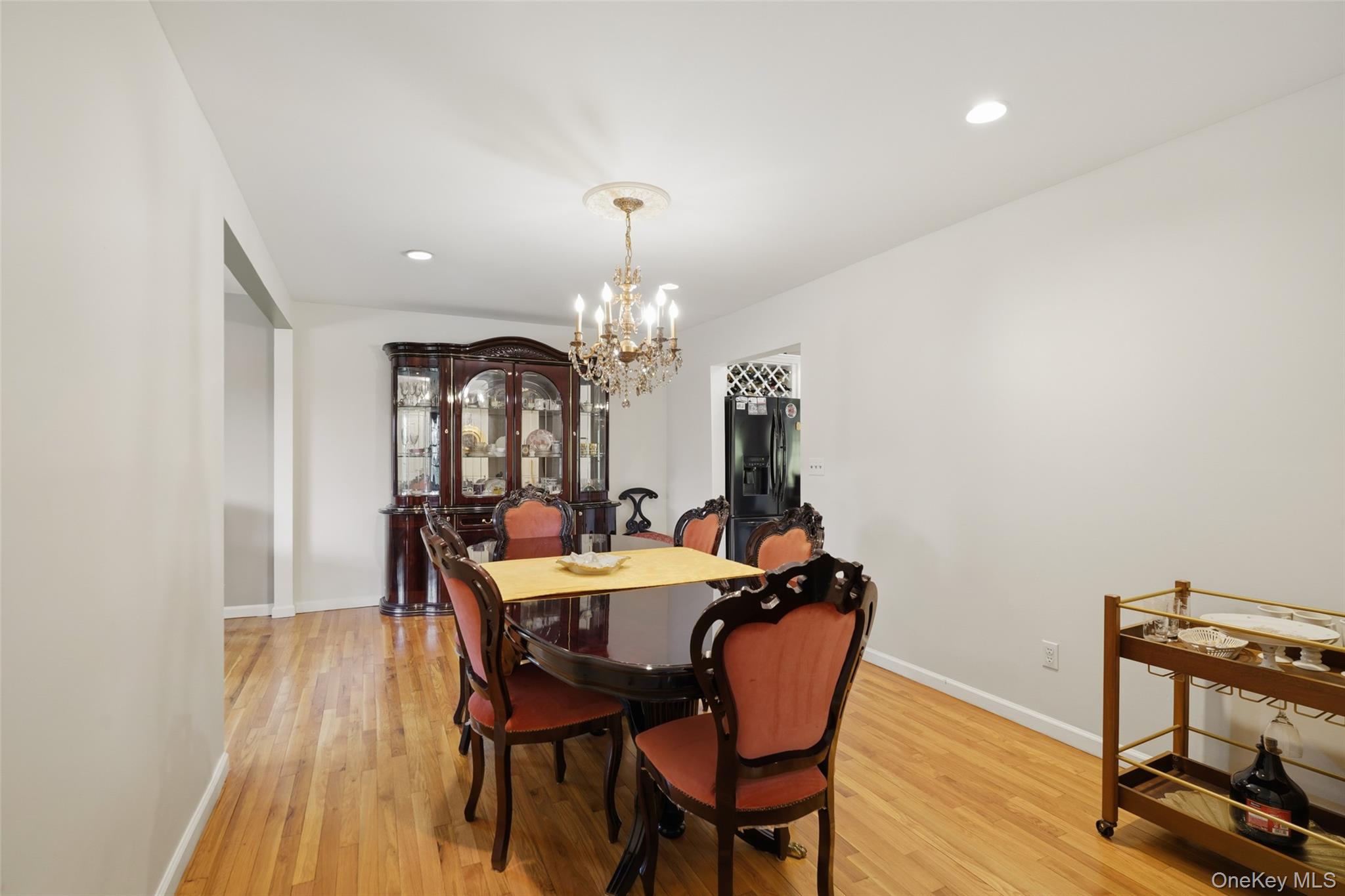 623 Cardinal Road Cortlandt Manor, NY 10567 - Photo 14 of 40 a view of a dining room with furniture and chandelier