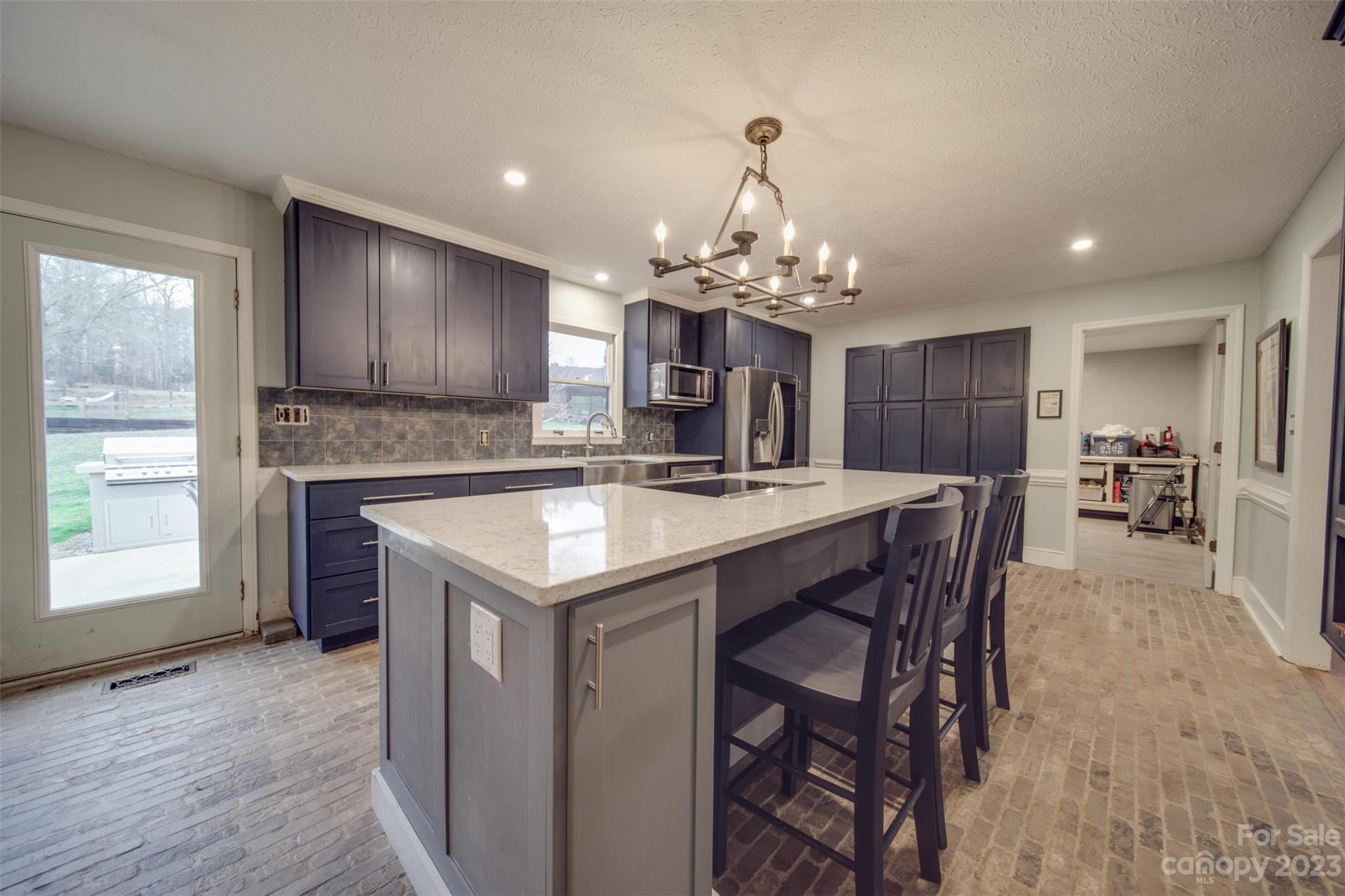 2699 Sharon Road York, SC 29745 - Photo 8 of 36 a large kitchen with a table and chairs
