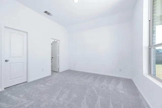 an empty room with windows