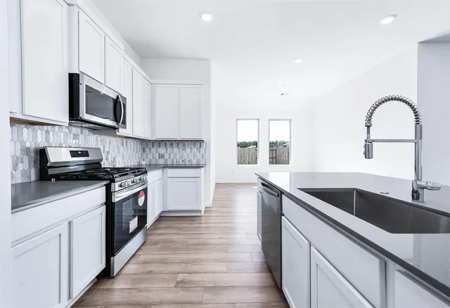 an aerial view of a house with a lake view