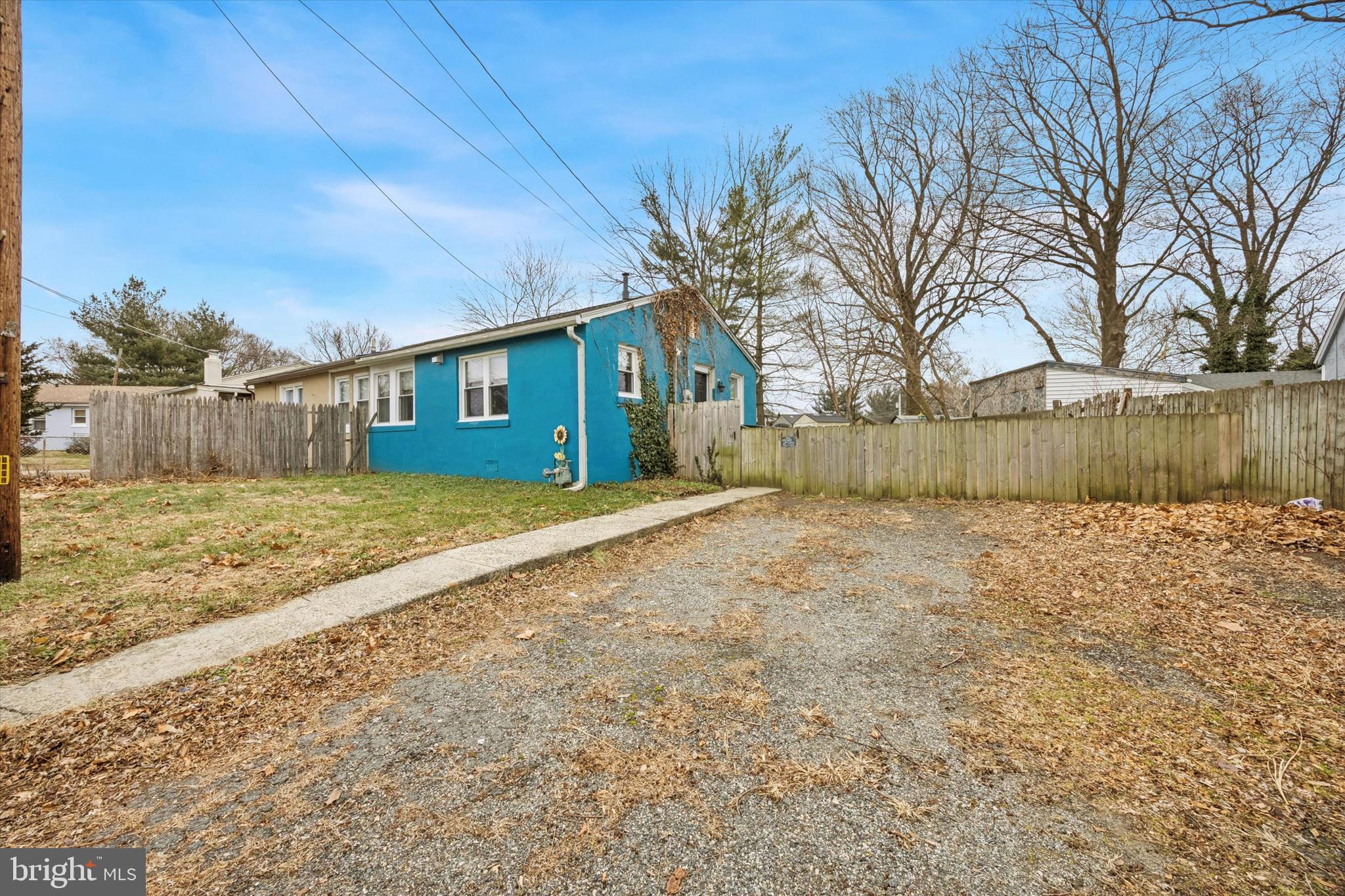 403 Denver Court Wallingford, PA 19086 - Photo 2 of 13 a front view of a house with a garden