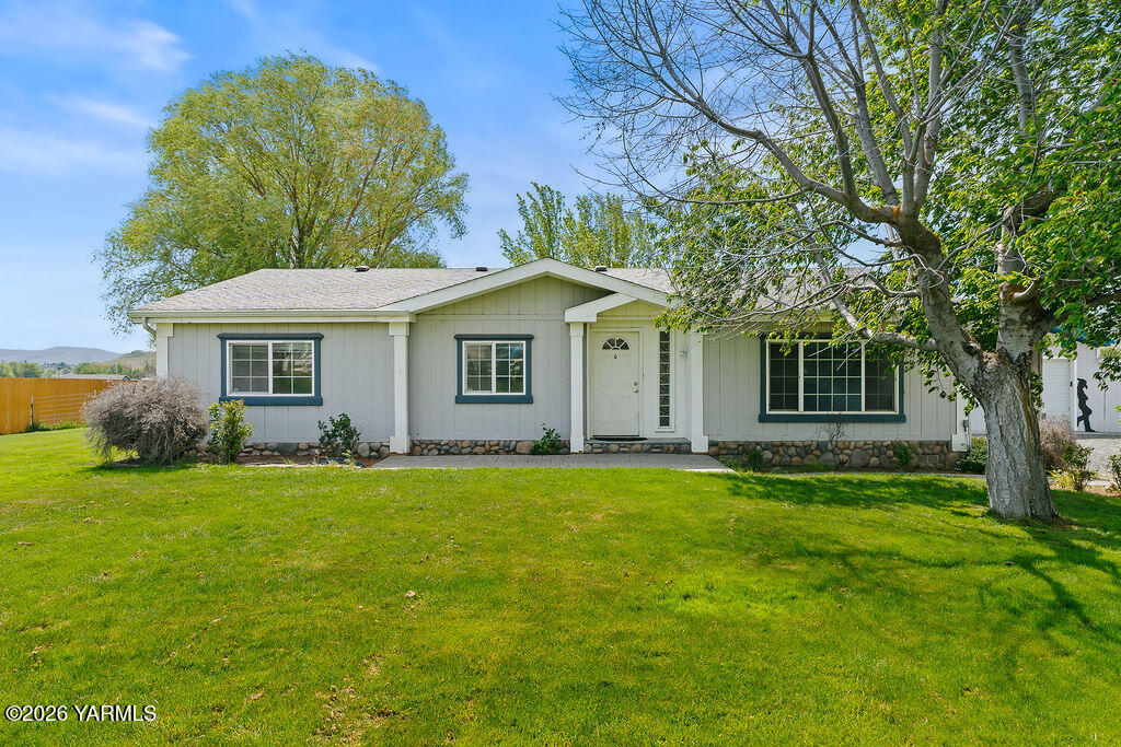 1550 Gibson Road Selah, WA 98942 - Photo 1 of 33 a front view of a house with a garden