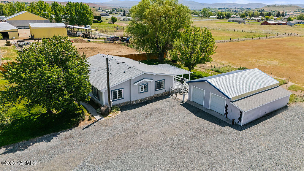 1550 Gibson Road Selah, WA 98942 - Photo 3 of 33 a view of a house with outdoor space and lake view