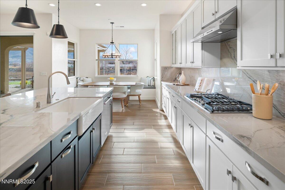 2330 Blushing Rock Drive Reno, NV 89521 - Photo 13 of 60 a kitchen with sink stove and cabinets