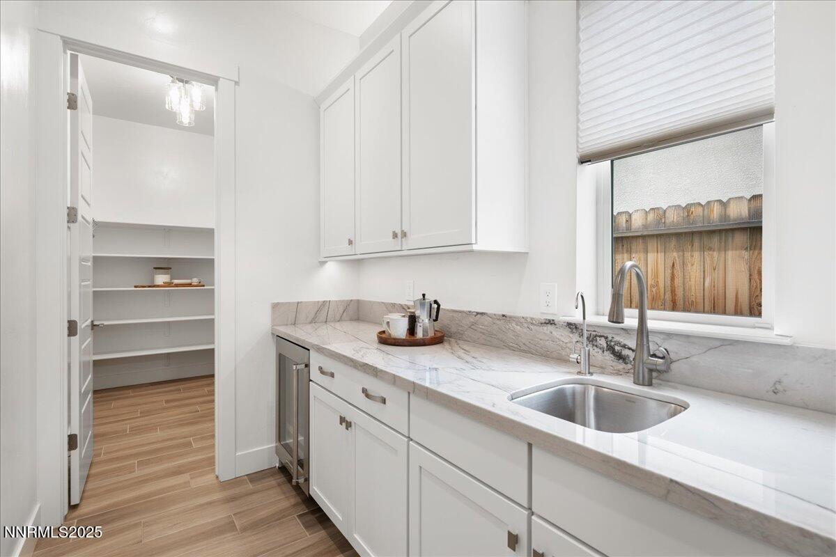 2330 Blushing Rock Drive Reno, NV 89521 - Photo 16 of 60 a kitchen with granite countertop a sink and a window