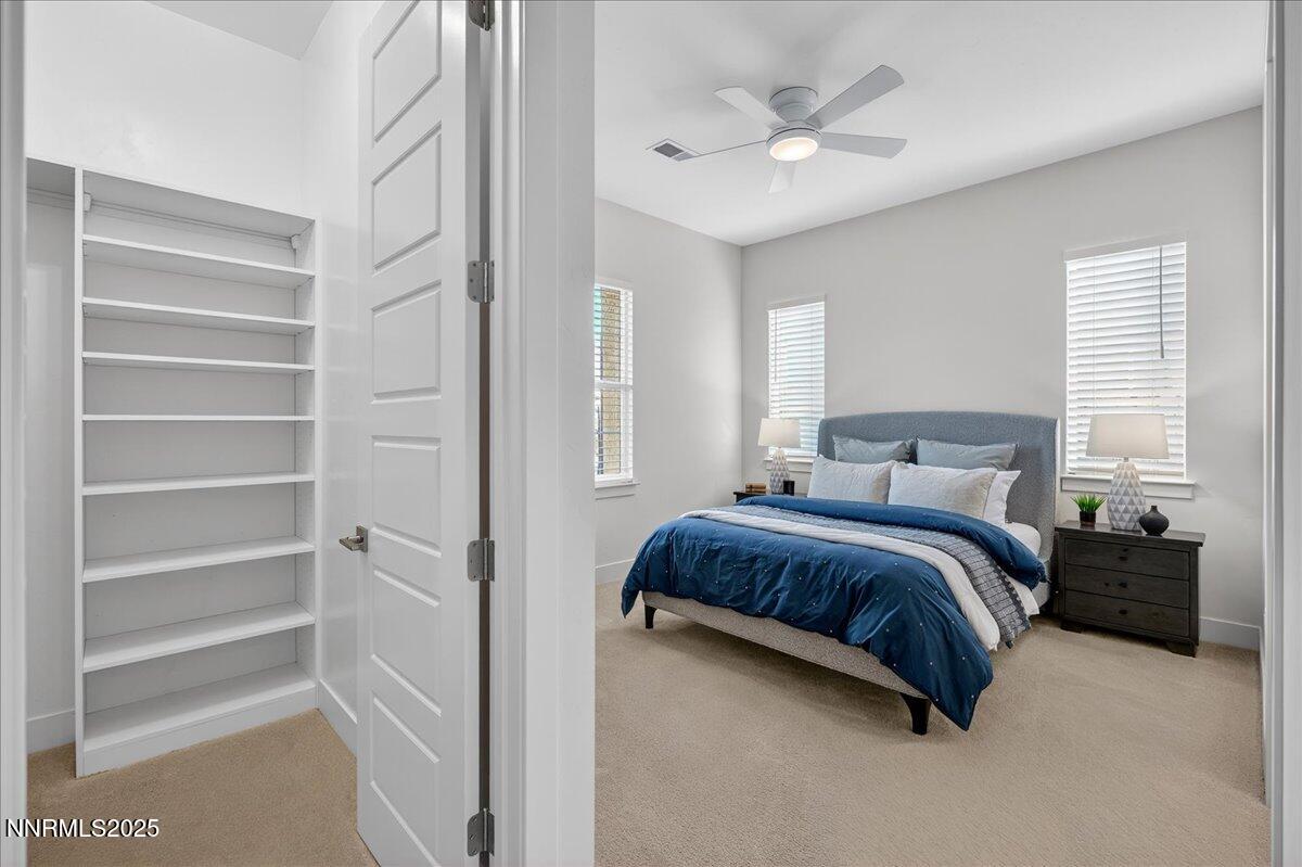 2330 Blushing Rock Drive Reno, NV 89521 - Photo 30 of 60 a bedroom with a bed and a ceiling fan