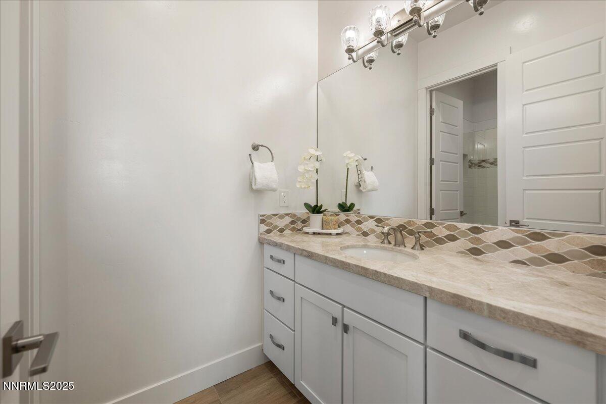 2330 Blushing Rock Drive Reno, NV 89521 - Photo 32 of 60 a bathroom with a sink and a mirror