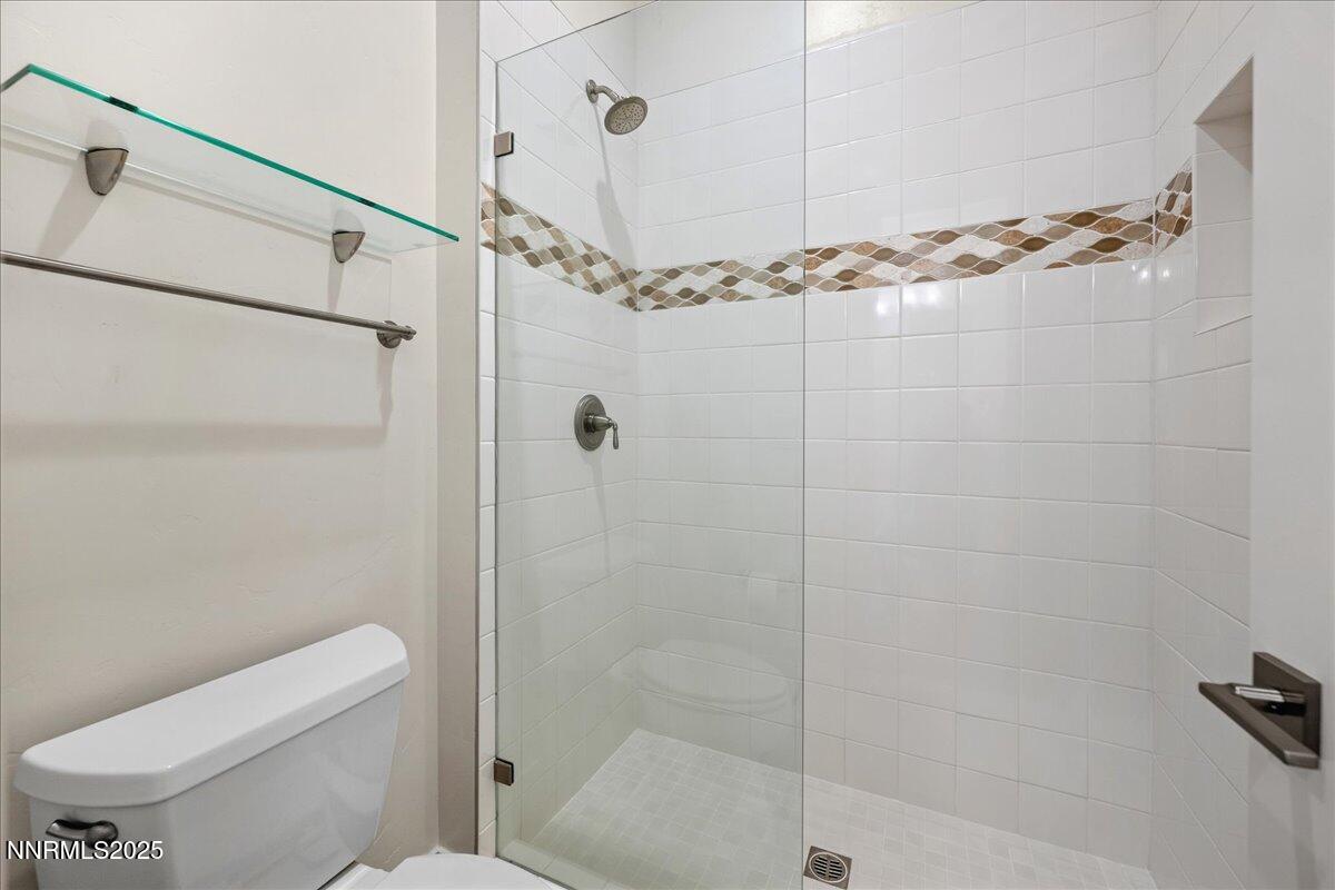 2330 Blushing Rock Drive Reno, NV 89521 - Photo 33 of 60 a bathroom with a shower toilet and sink