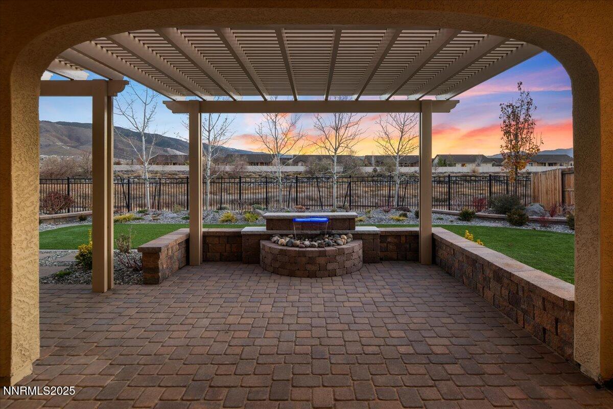 2330 Blushing Rock Drive Reno, NV 89521 - Photo 44 of 60 a view of a patio with a table and chairs