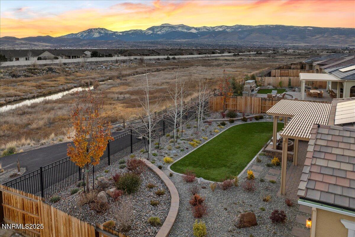 2330 Blushing Rock Drive Reno, NV 89521 - Photo 49 of 60 a view of a lake with a mountain in the background