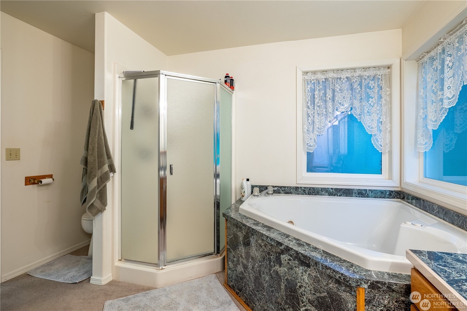 1659 West Gillis Road Othello, WA 99344 - Photo 18 of 36 a bathroom with a bathtub and a shower