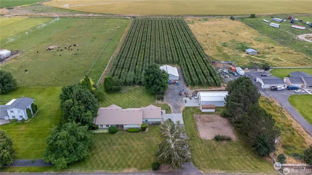 an aerial view of a house with a garden