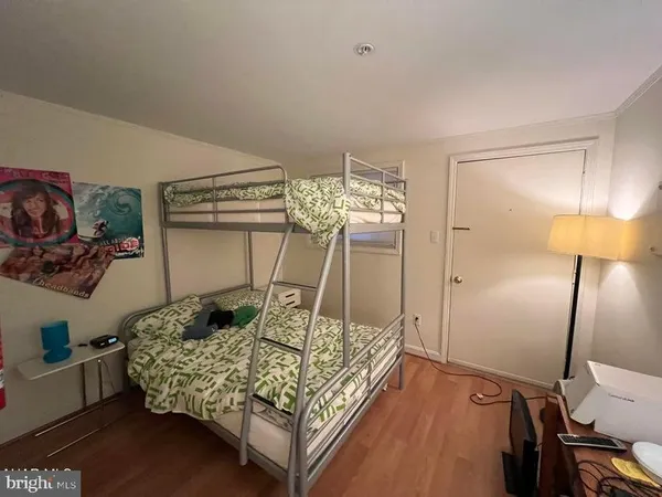a bedroom with a bed and walk in closet