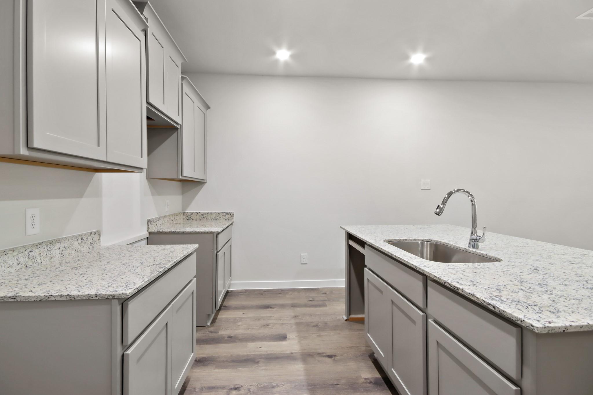 4533 Wisenbaker Way Bryan, TX 77845 - Photo 5 of 25 a kitchen with a sink and cabinets