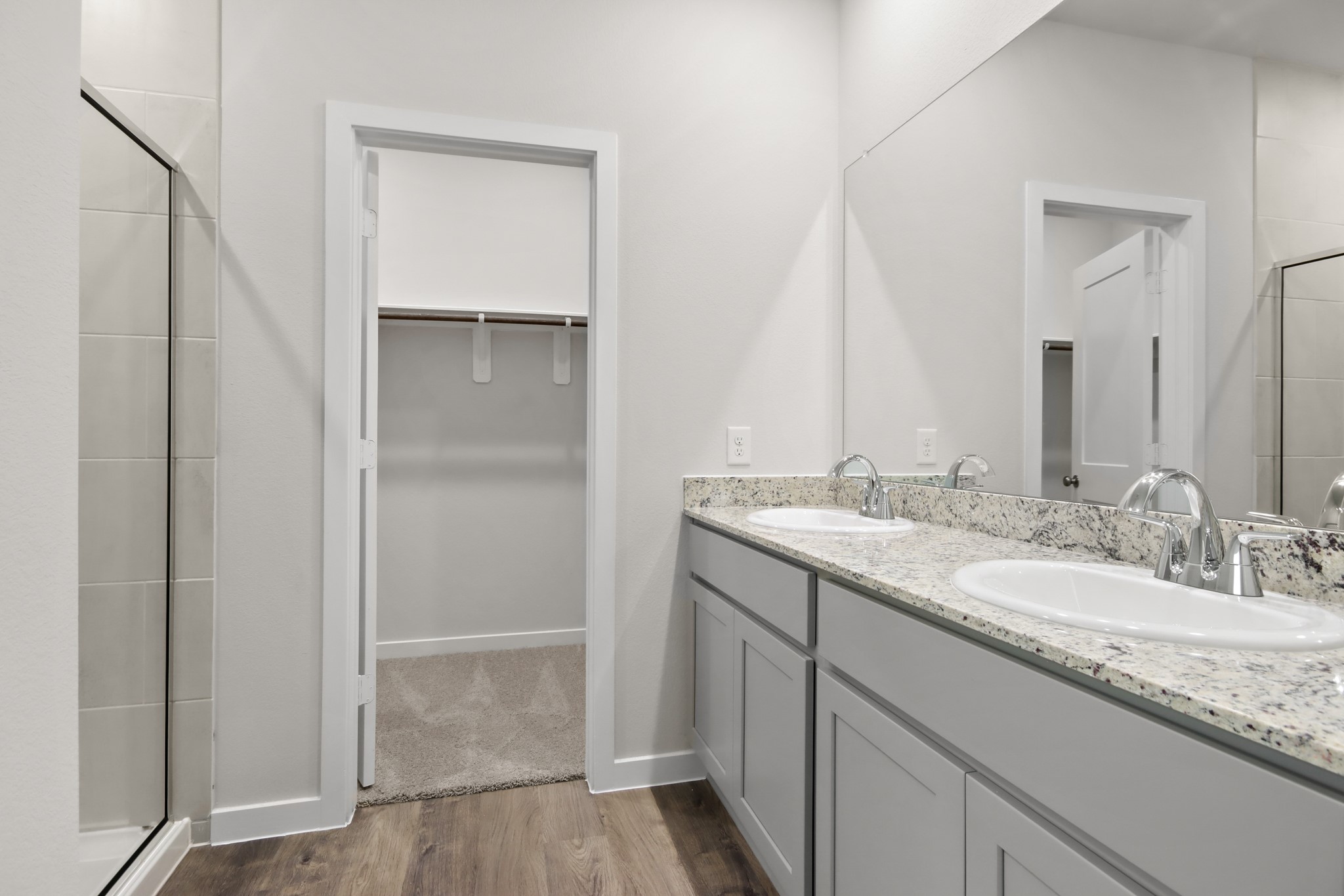 4533 Wisenbaker Way Bryan, TX 77845 - Photo 9 of 25 a bathroom with a granite countertop sink and a mirror