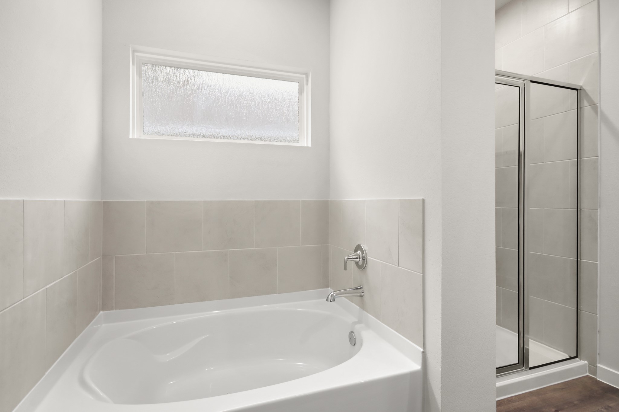 4533 Wisenbaker Way Bryan, TX 77845 - Photo 10 of 25 a white bath tub sitting next to a window