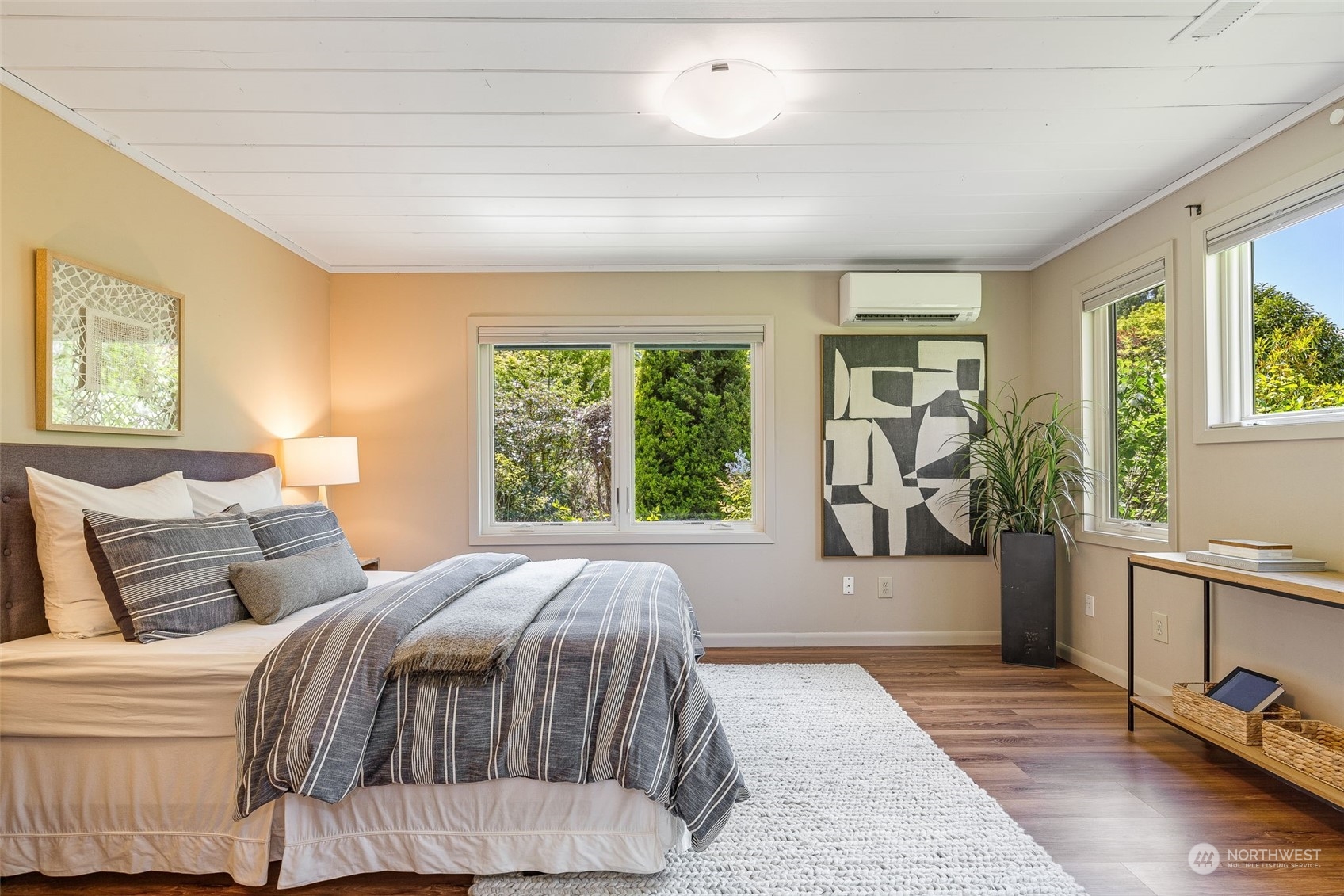 5337 South Kenyon Street Seattle, WA 98118 - Photo 12 of 37 a bedroom with a large bed and a large window