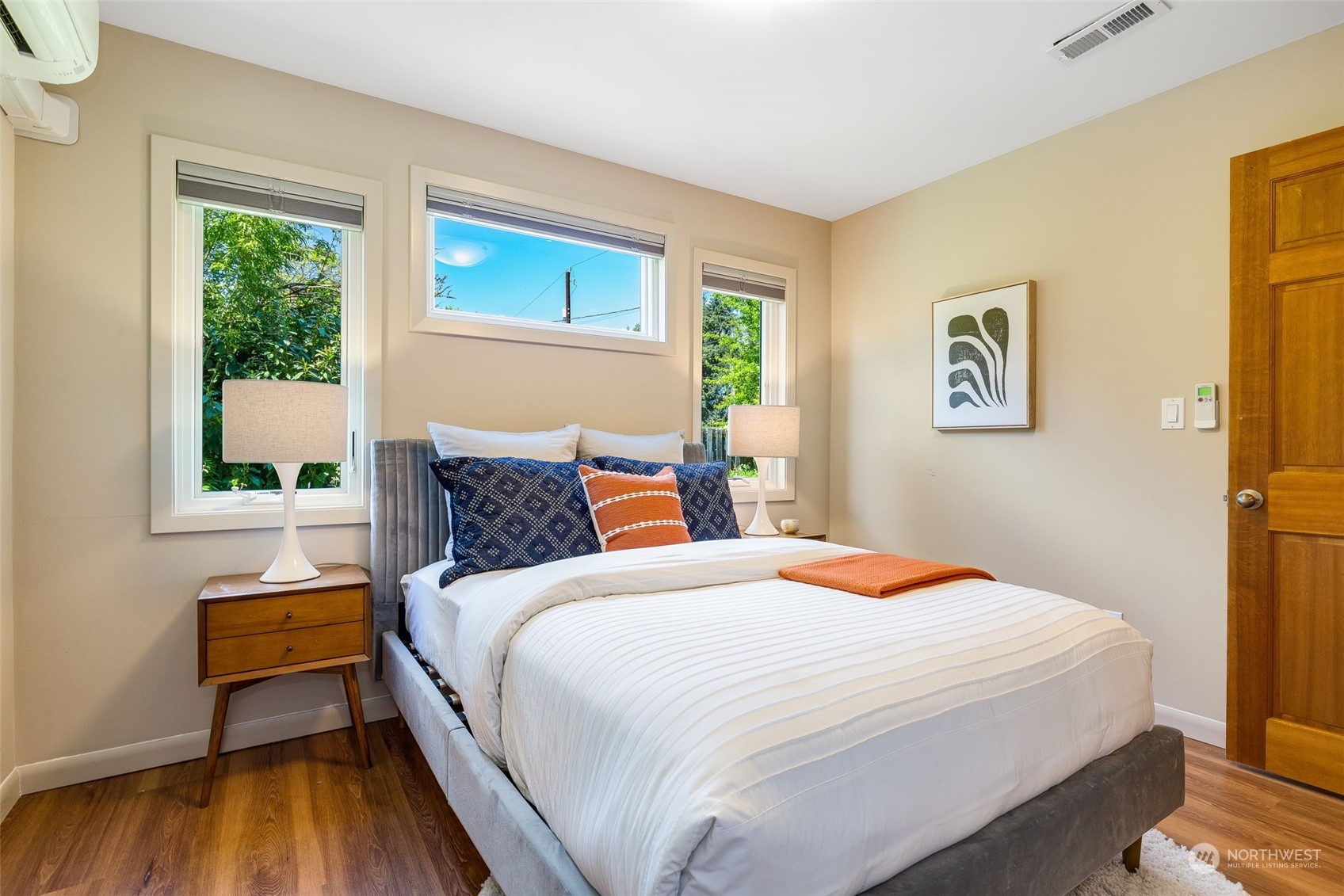 5337 South Kenyon Street Seattle, WA 98118 - Photo 13 of 37 a bedroom with a bed and wooden floor