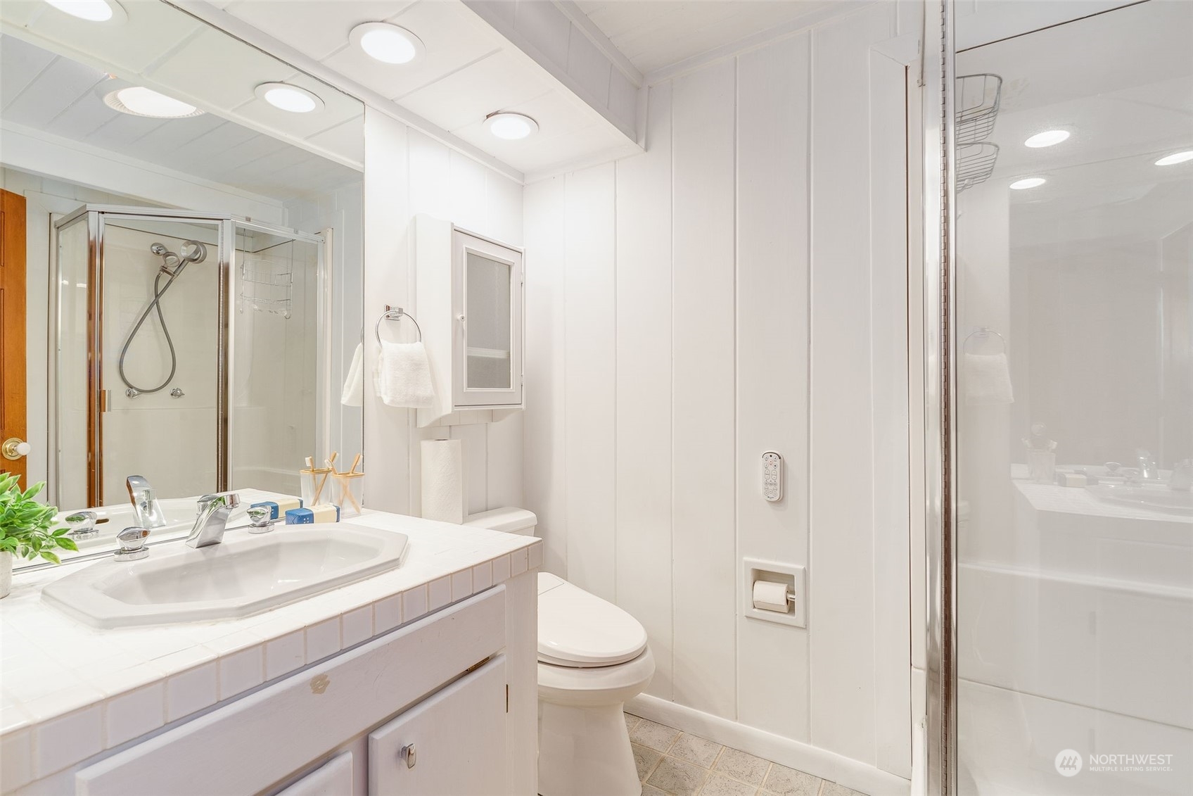 5337 South Kenyon Street Seattle, WA 98118 - Photo 14 of 37 a bathroom with a sink a toilet and shower