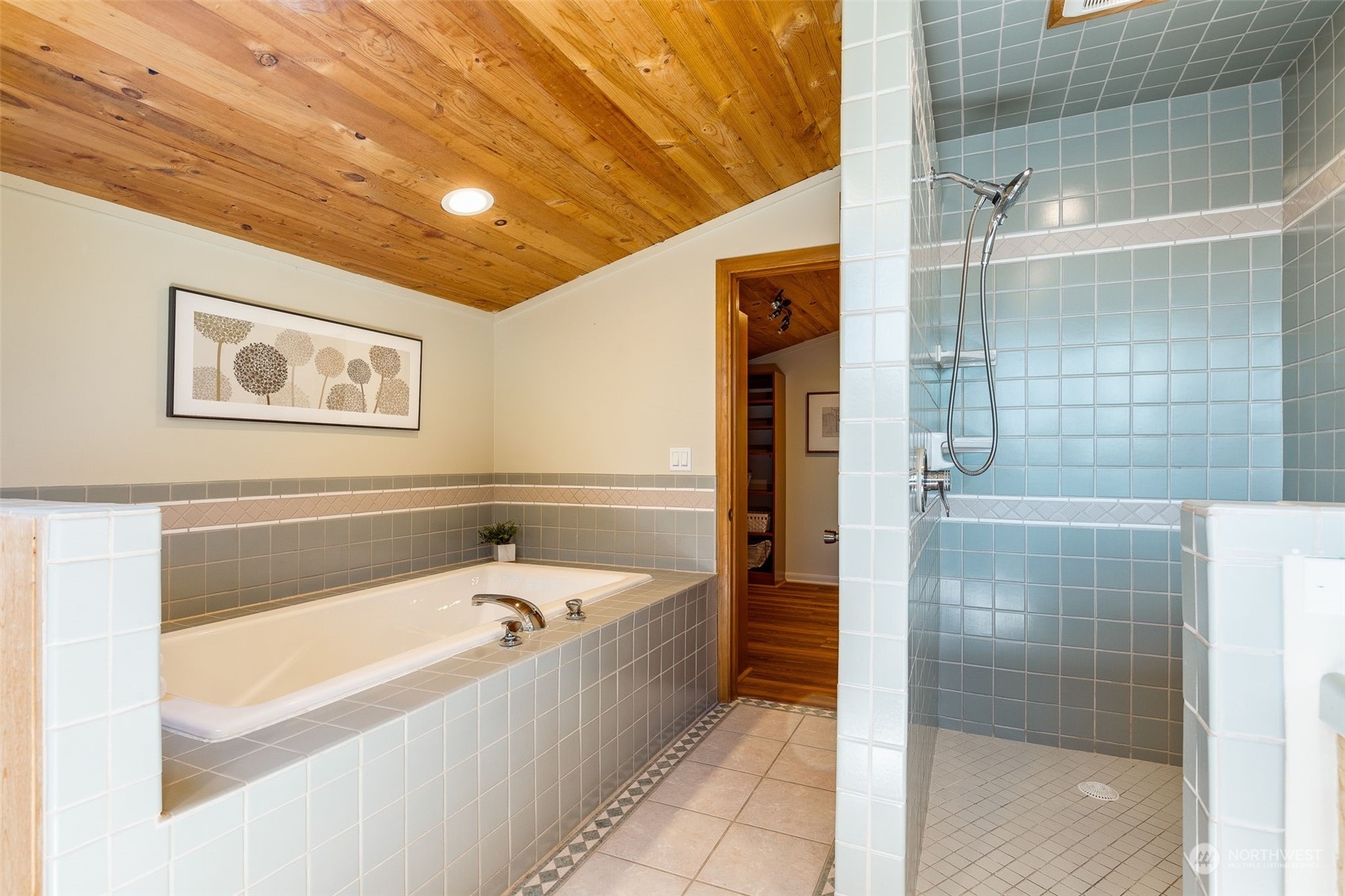 5337 South Kenyon Street Seattle, WA 98118 - Photo 21 of 37 a bathroom with a bathtub and shower