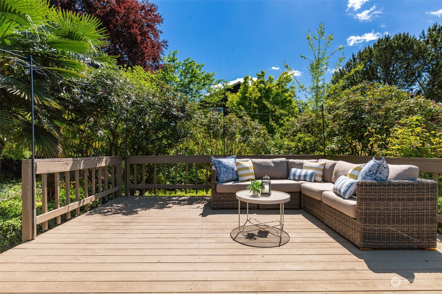 5337 South Kenyon Street Seattle, WA 98118 - Photo 25 of 37 a view of a patio with couches chairs and wooden floor