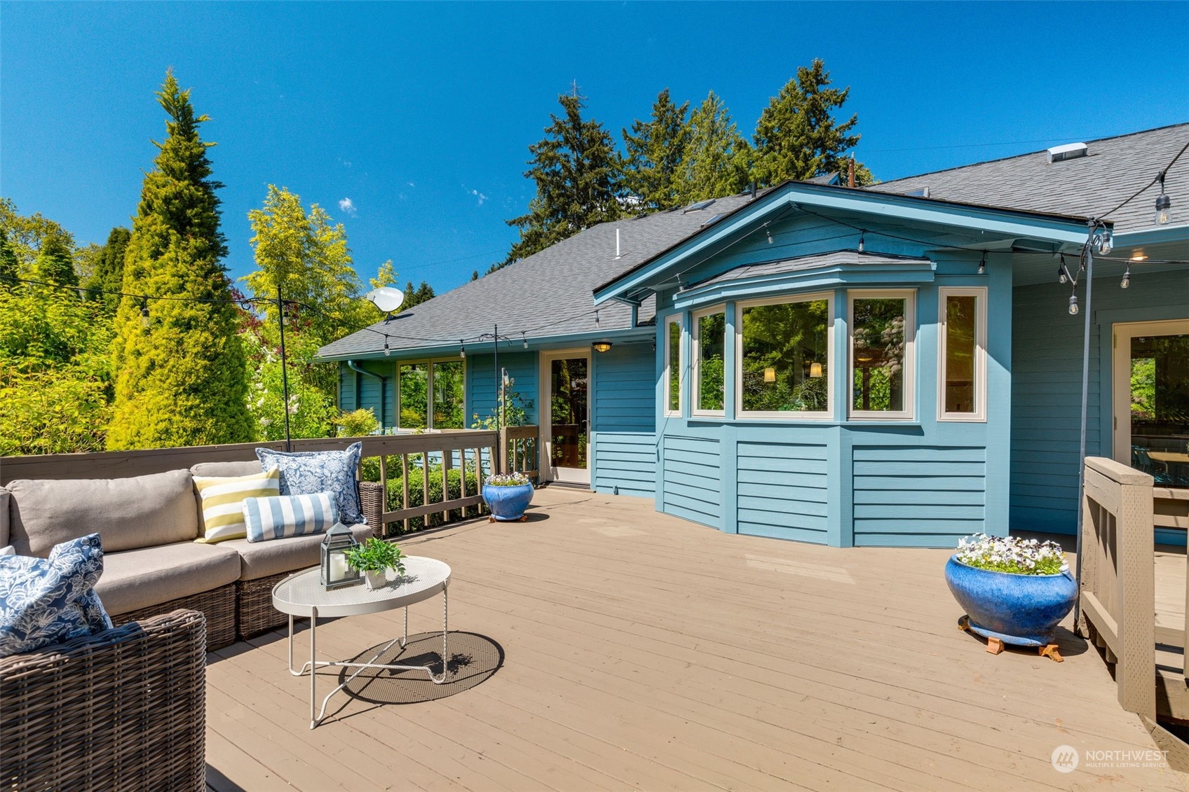 5337 South Kenyon Street Seattle, WA 98118 - Photo 27 of 37 a view of a patio with couches table and chairs and potted plants