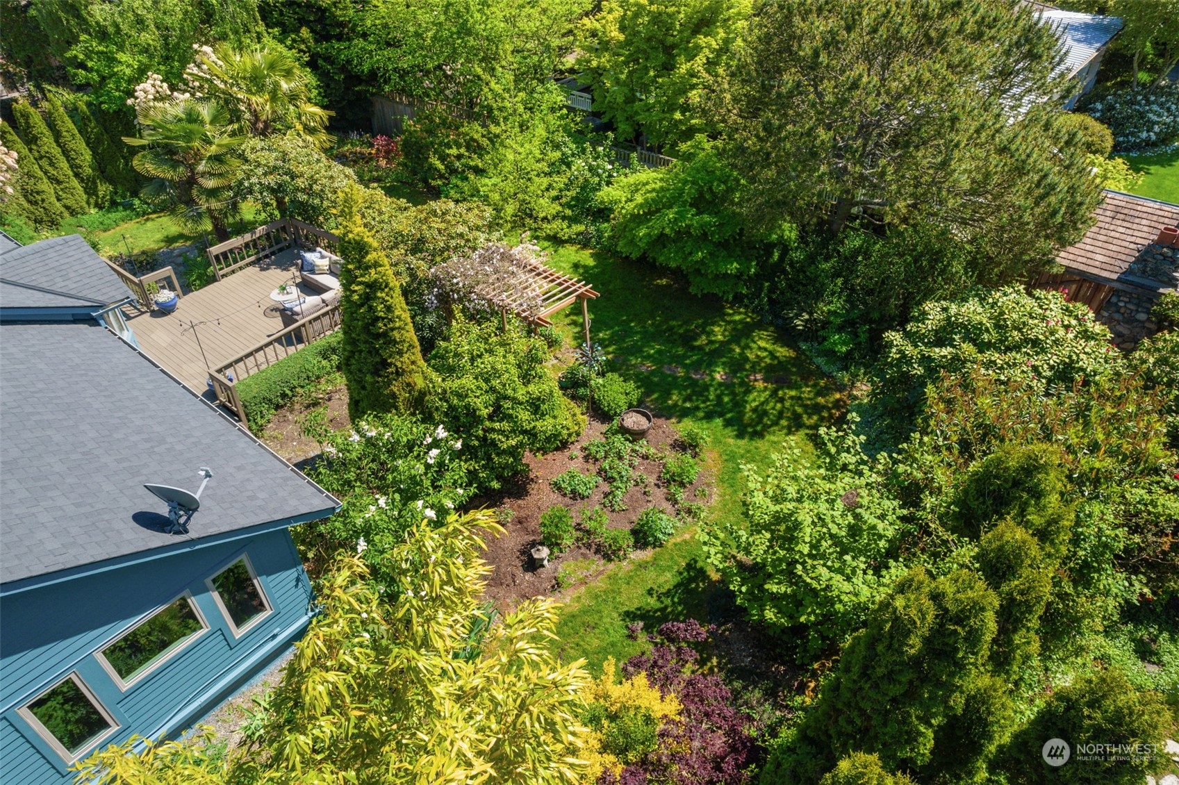 5337 South Kenyon Street Seattle, WA 98118 - Photo 32 of 37 an aerial view of a house with a yard