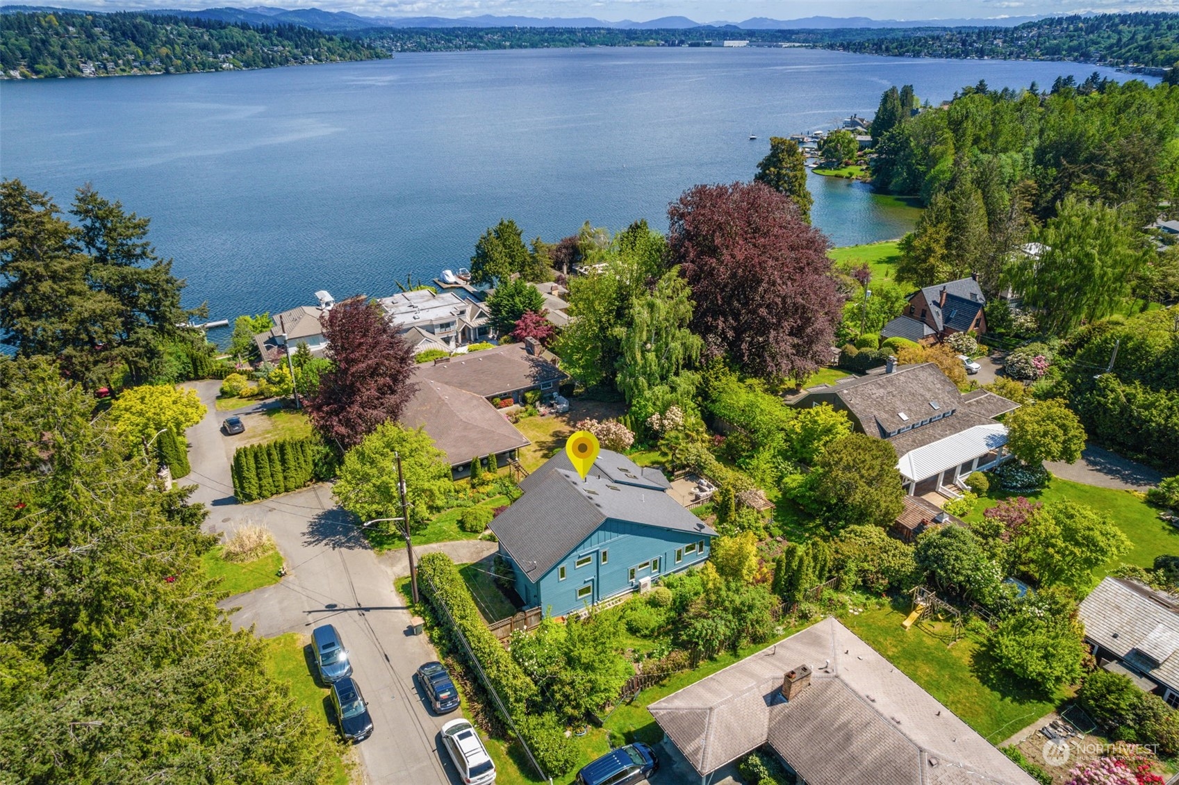 5337 South Kenyon Street Seattle, WA 98118 - Photo 35 of 37 an aerial view of a house with a yard and a garden