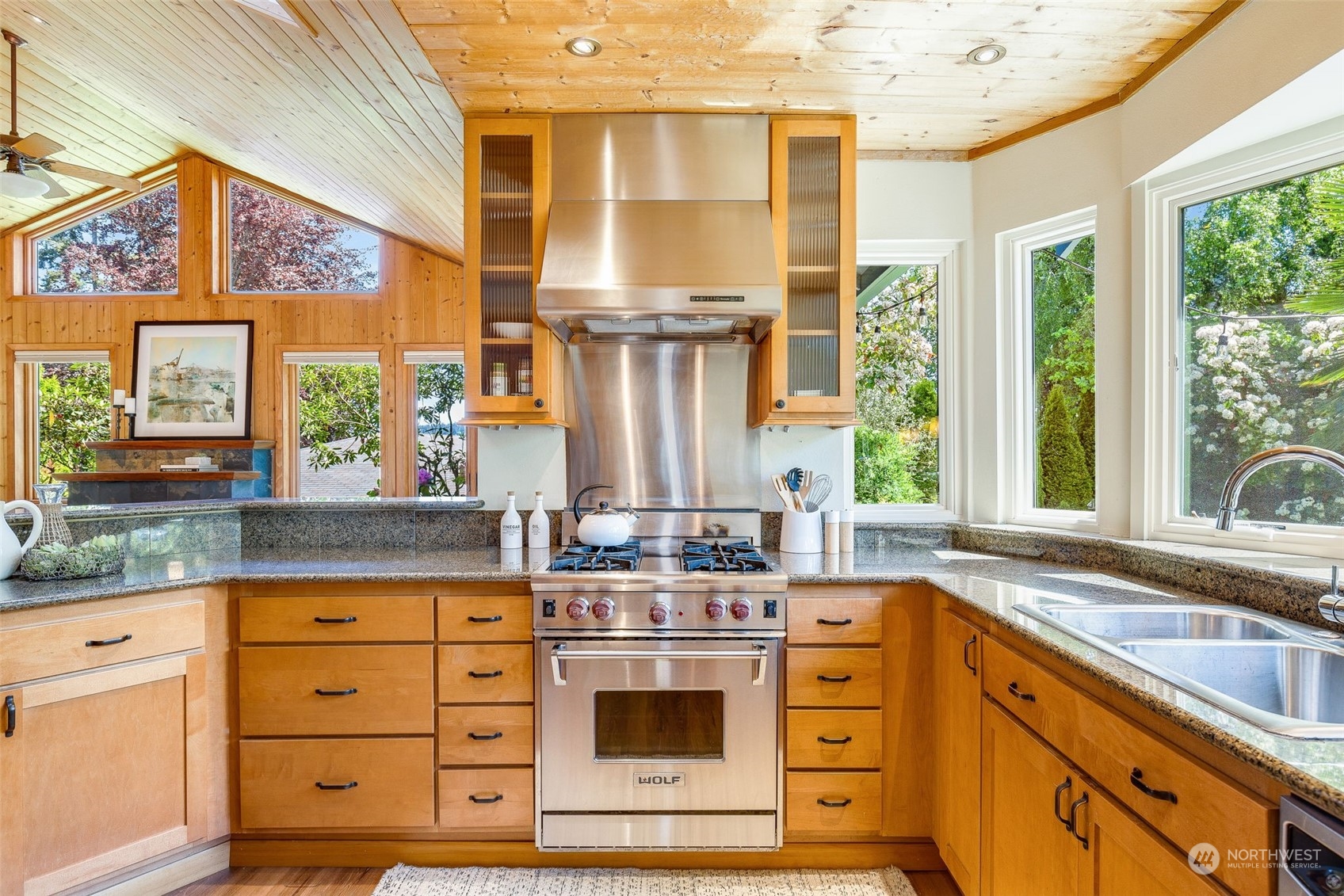 5337 South Kenyon Street Seattle, WA 98118 - Photo 8 of 37 a kitchen with stainless steel appliances a stove and a sink