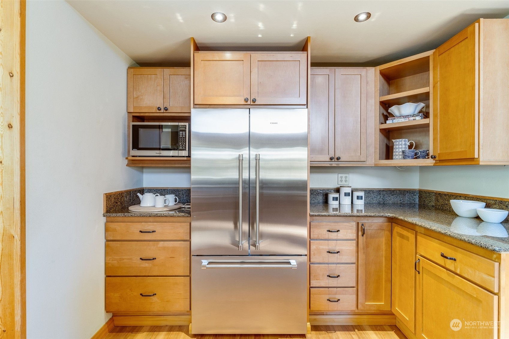 5337 South Kenyon Street Seattle, WA 98118 - Photo 10 of 37 a kitchen with stainless steel appliances cabinets and a window