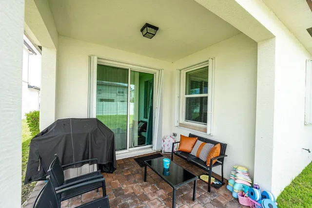 a living room with furniture and a window