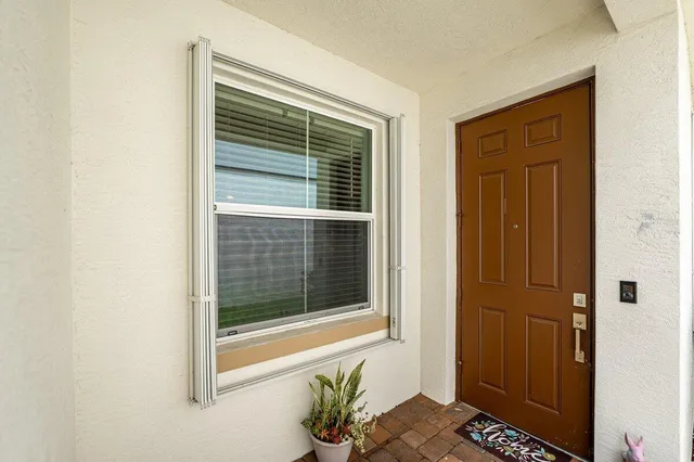 a view of a door and a window