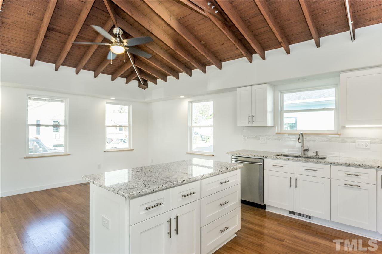 208 Bledsoe Avenue Raleigh, NC 27601 - Photo 3 of 16 Open kitchen/dining area with exposed original roof structure. Gorgeous!