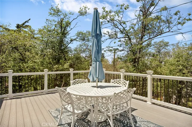 a balcony with a table and chairs