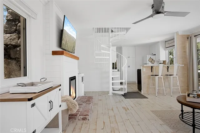 a view of kitchen with furniture and wooden floor