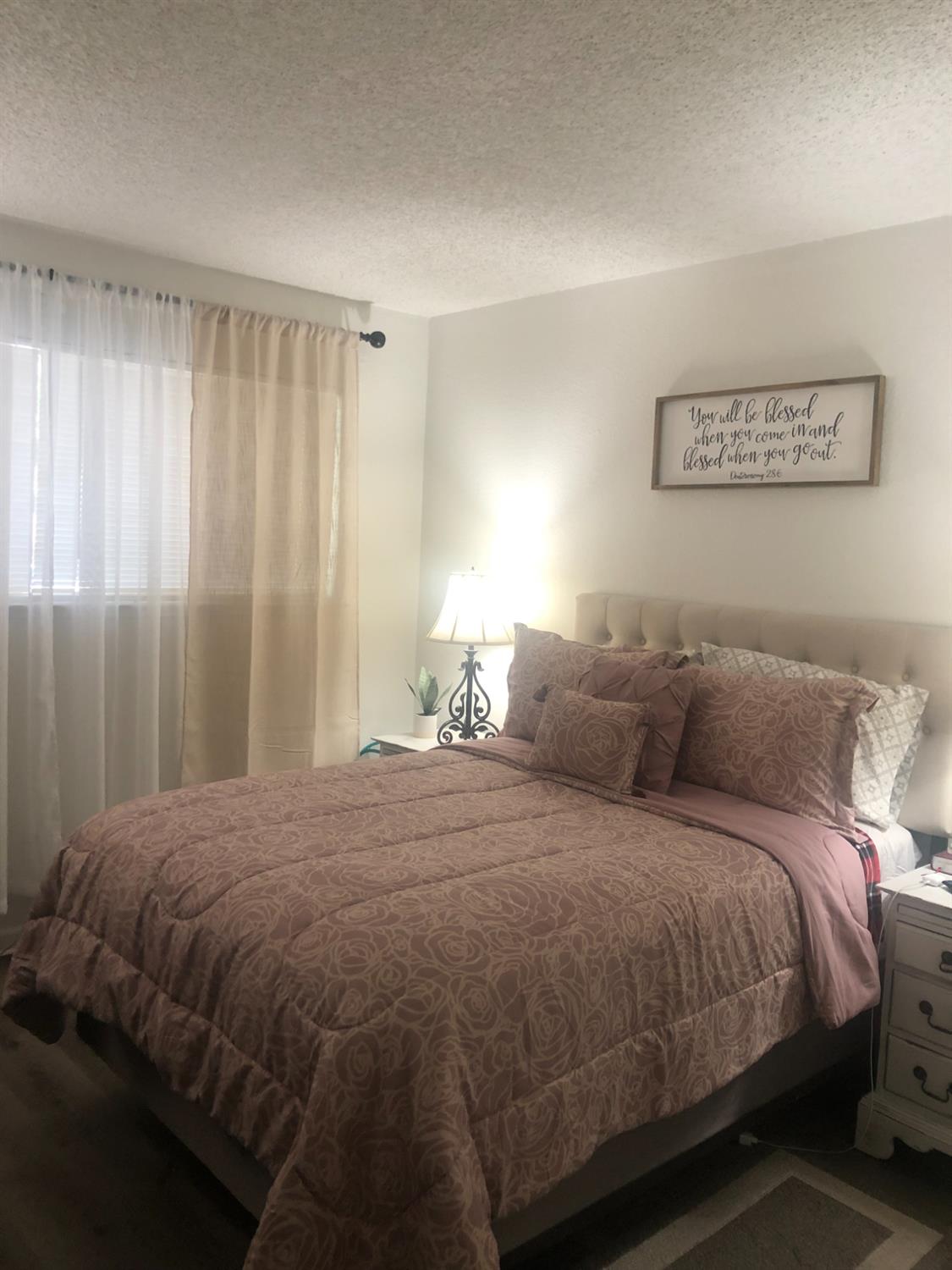 5604 Walerga Road, Unit 1 Sacramento, CA 95842 - Photo 9 of 9 a bedroom with a bed and a window