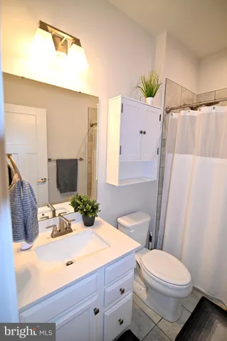 a view of living room with furniture and wooden floor