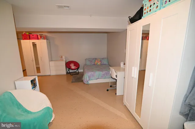 a room with pool table and couches