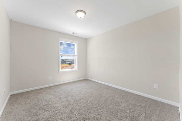 249 Samuel Street Pendleton, SC 29670 - Photo 12 of 33 Bedroom#2 This cozy room offers natural light and comfortable carpet flooring, perfect for relaxation.