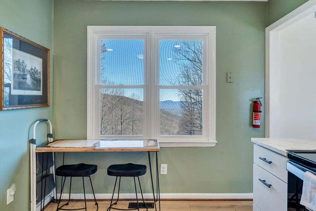 1039 Fosters Knob Road Blue Ridge, VA 24064 - Photo 11 of 45 a dining room with table and chair