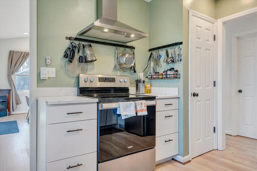 1039 Fosters Knob Road Blue Ridge, VA 24064 - Photo 14 of 45 a kitchen with stainless steel appliances granite countertop a stove and a refrigerator