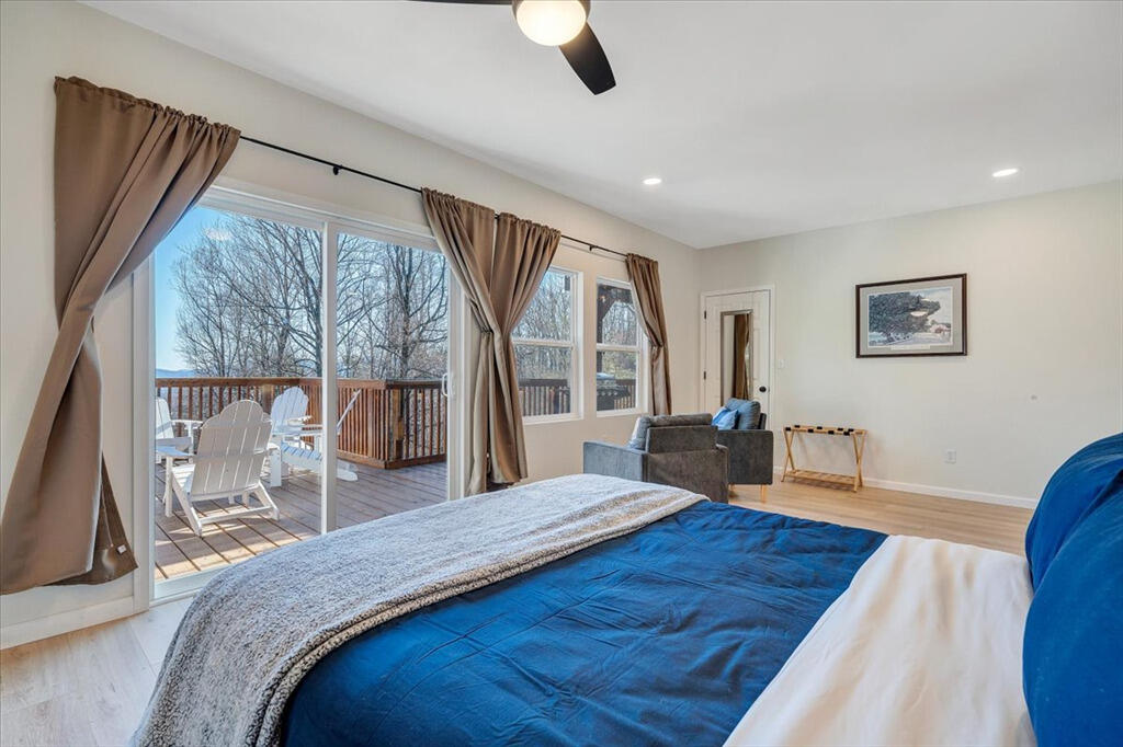 1039 Fosters Knob Road Blue Ridge, VA 24064 - Photo 25 of 45 a bed room with a bed and a large window
