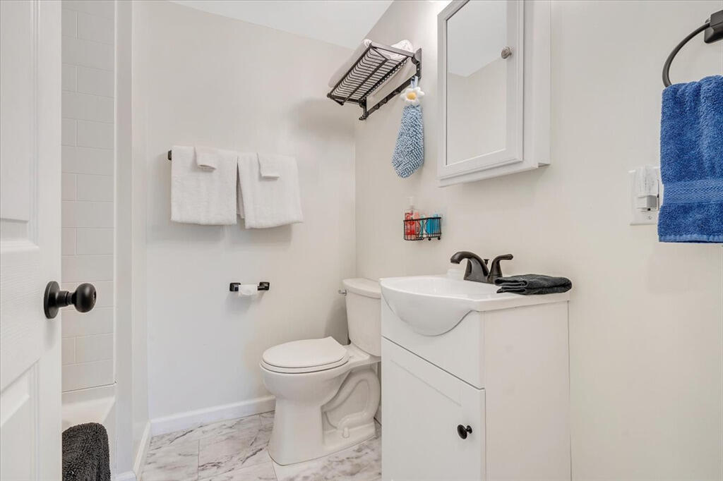 1039 Fosters Knob Road Blue Ridge, VA 24064 - Photo 26 of 45 a bathroom with a sink a toilet and shower
