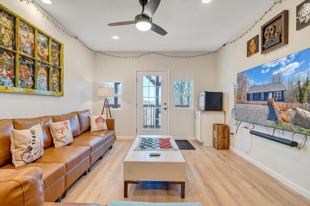 1039 Fosters Knob Road Blue Ridge, VA 24064 - Photo 31 of 45 a living room with furniture and a flat screen tv