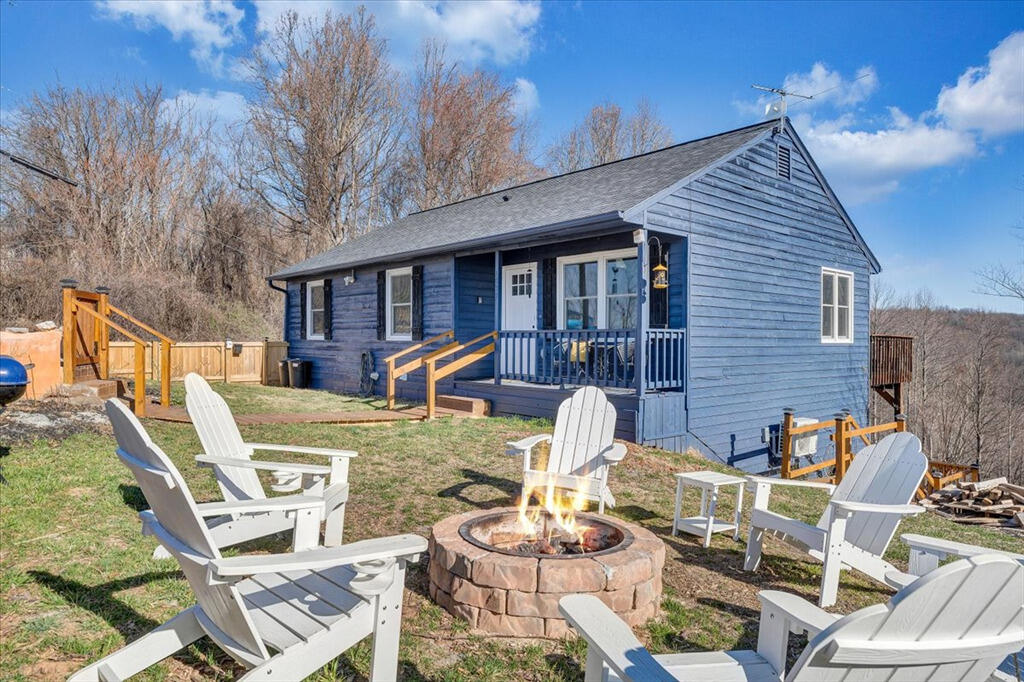 1039 Fosters Knob Road Blue Ridge, VA 24064 - Photo 33 of 45 a view of a patio with furniture and a fire pit