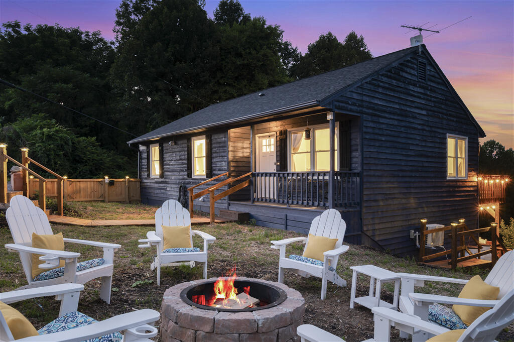 1039 Fosters Knob Road Blue Ridge, VA 24064 - Photo 39 of 45 a backyard of a house with fire pit and outdoor seating