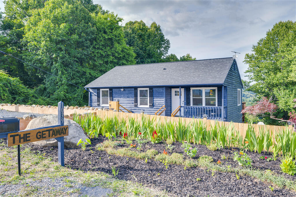 1039 Fosters Knob Road Blue Ridge, VA 24064 - Photo 41 of 45 a view of a house with a yard and sitting area