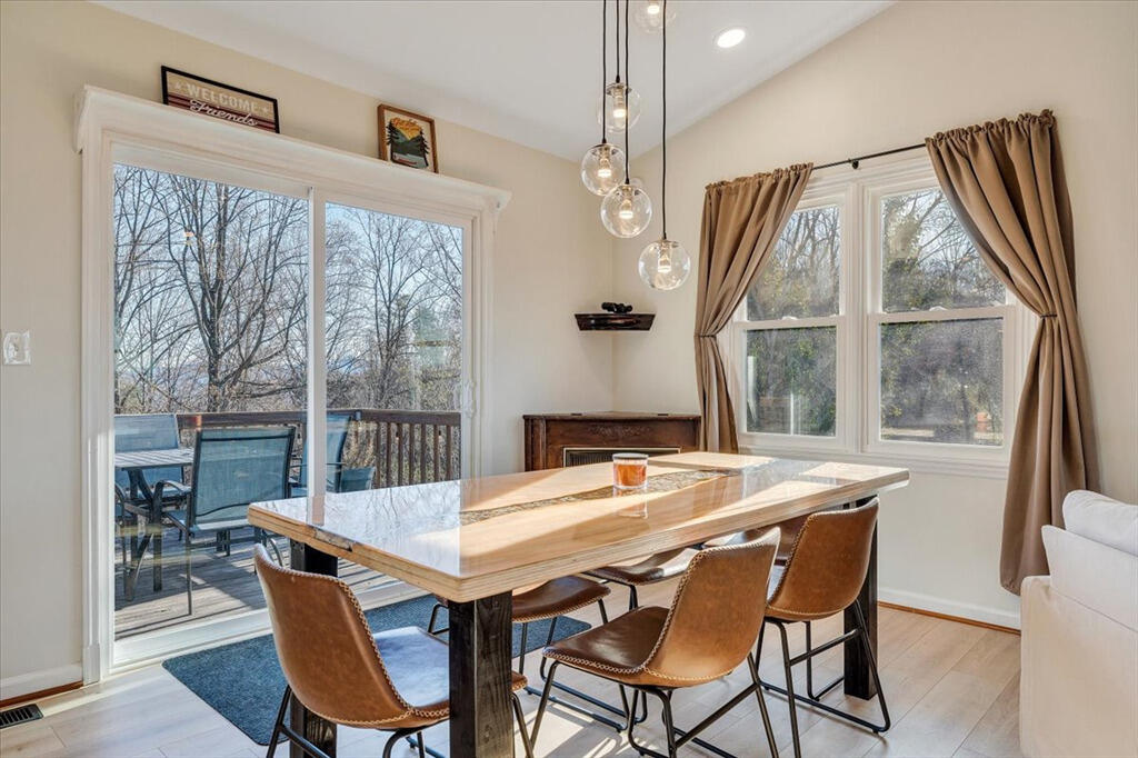 1039 Fosters Knob Road Blue Ridge, VA 24064 - Photo 6 of 45 a view of a dining room with furniture window and wooden floor